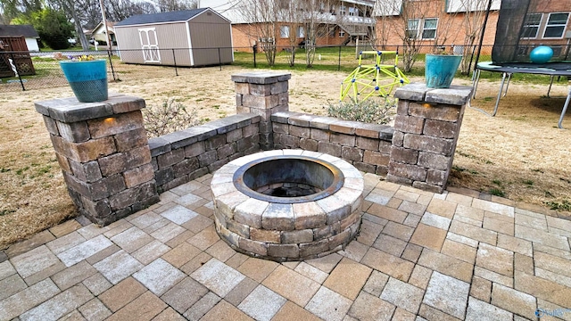403 E Charlotte Ave, Scottsboro, AL 35768 - details with a fenced backyard and an outdoor fire pit
