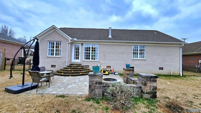 403 E Charlotte Ave, Scottsboro, AL 35768 - rear view of property featuring brick siding, crawl space, and a fenced backyard