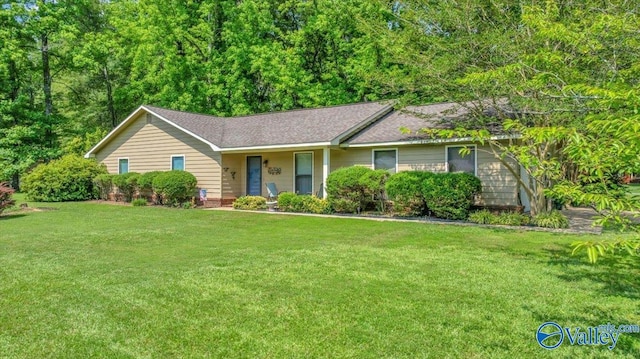 1511 Jason St, Albertville, AL 35950 - ranch-style house with a front yard, a shingled roof, and covered porch