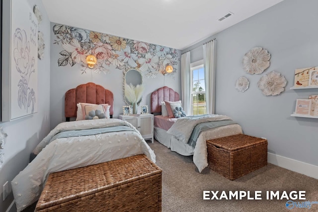 bedroom with carpet, visible vents, and baseboards