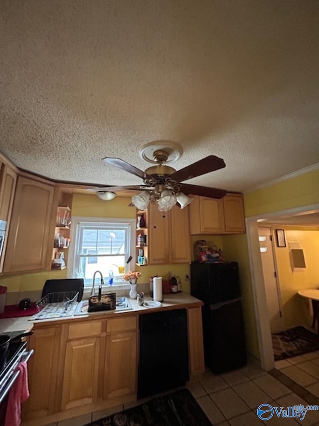 kitchen featuring sink, ceiling fan, black appliances, a textured ceiling, and light tile patterned flooring