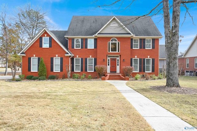 colonial inspired home with a front yard