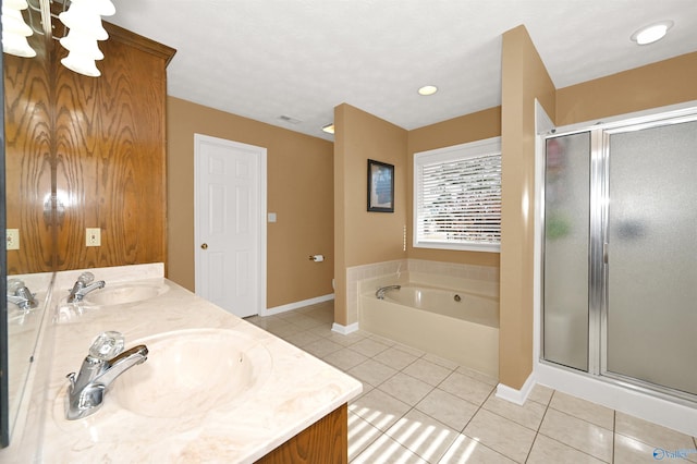 bathroom with tile patterned floors, plus walk in shower, and vanity