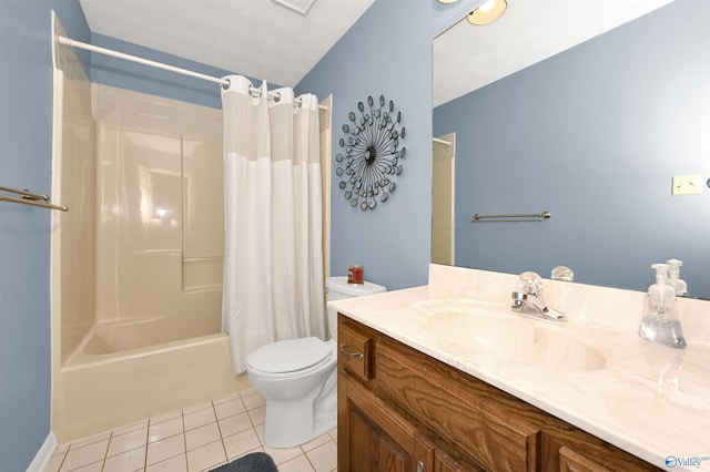 full bathroom with tile patterned floors, shower / bath combo with shower curtain, vanity, and toilet