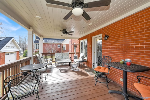 deck featuring outdoor lounge area and ceiling fan