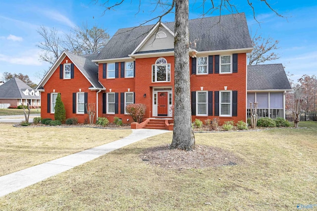 colonial house featuring a front yard