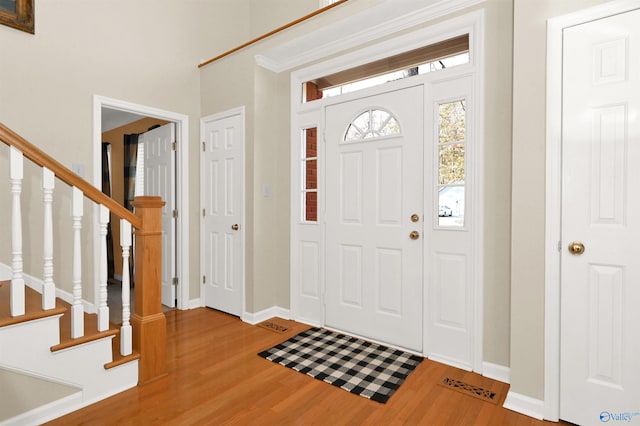 entrance foyer featuring hardwood / wood-style flooring