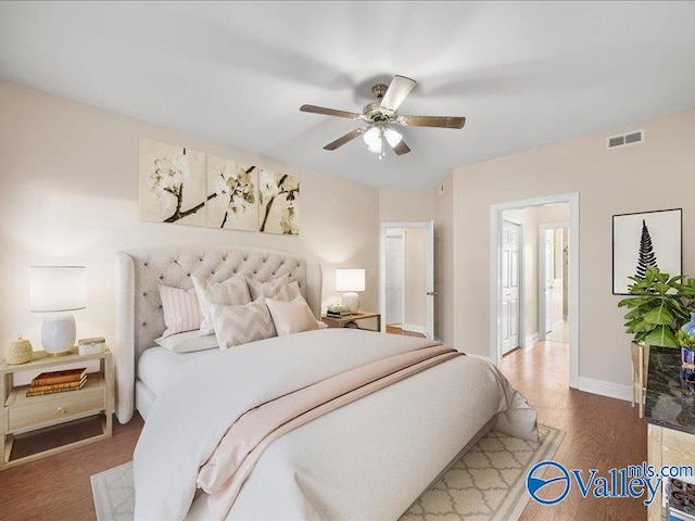 bedroom featuring hardwood / wood-style flooring and ceiling fan