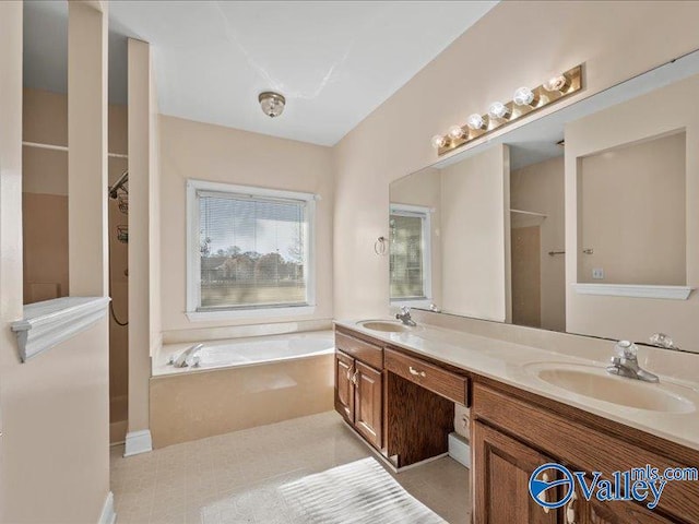 bathroom featuring vanity and shower with separate bathtub