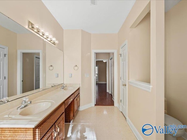 bathroom with tile patterned flooring and vanity