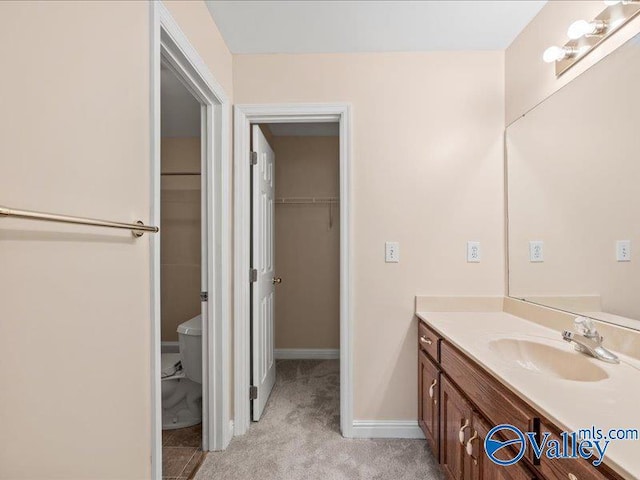 bathroom with vanity and toilet