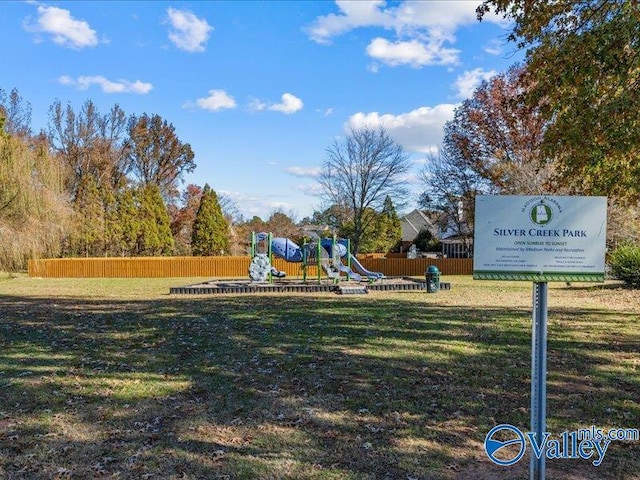 view of community with a lawn and a playground