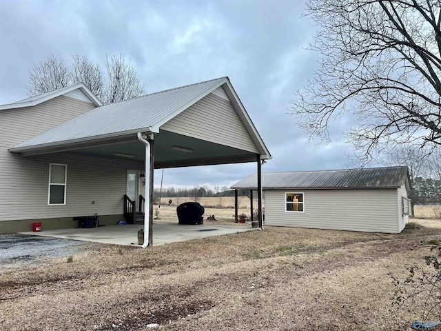 exterior space featuring an attached carport