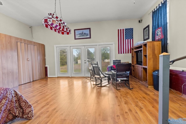 dining area featuring french doors and light hardwood / wood-style flooring