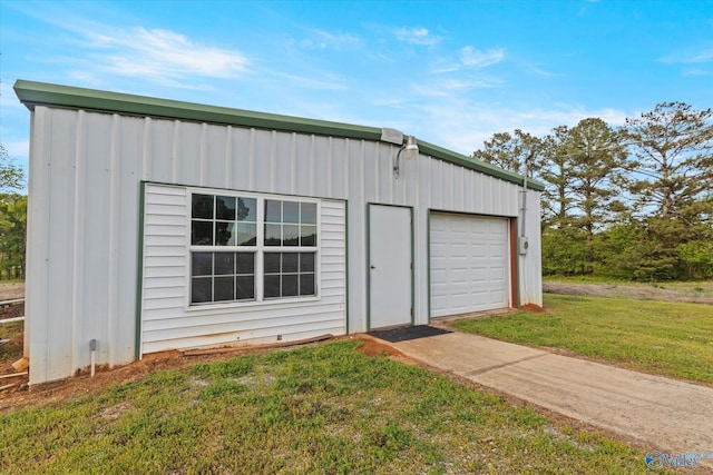 garage featuring a yard