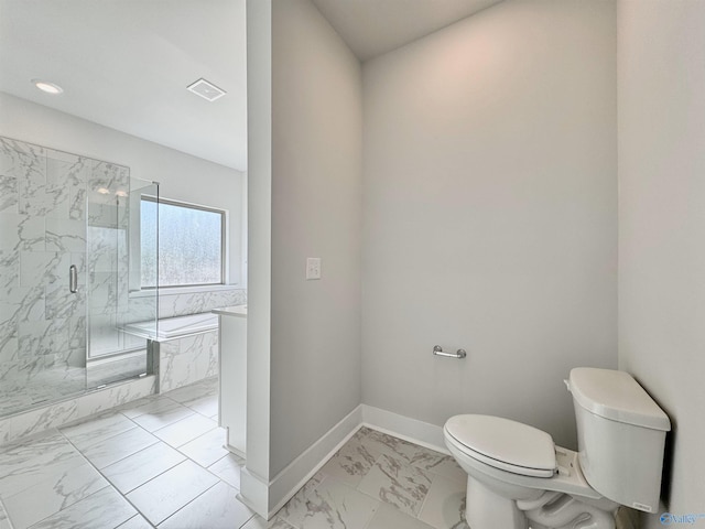 bathroom with toilet, marble finish floor, a garden tub, a marble finish shower, and baseboards