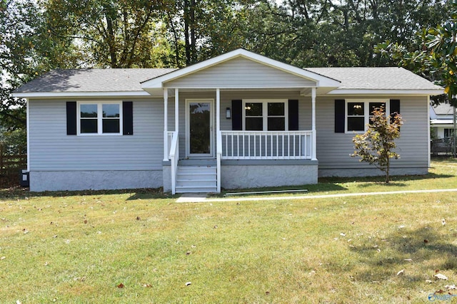 view of front of house with a porch and a front lawn