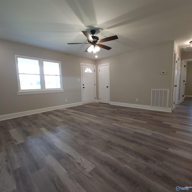 spare room featuring ceiling fan and dark hardwood / wood-style floors