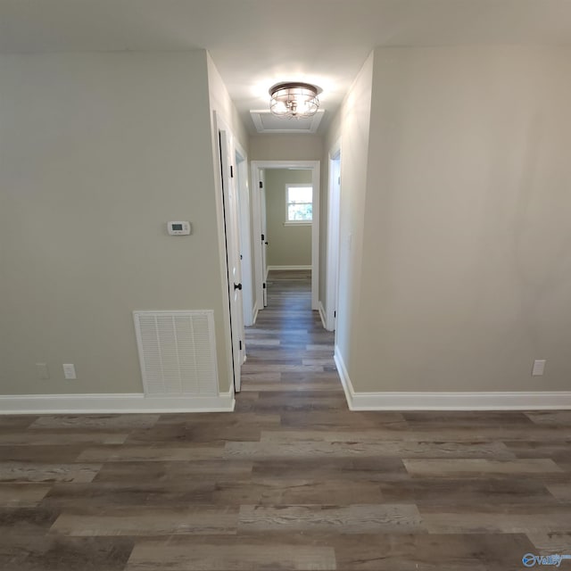 corridor with dark wood-type flooring