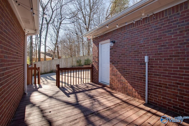 wooden deck featuring fence