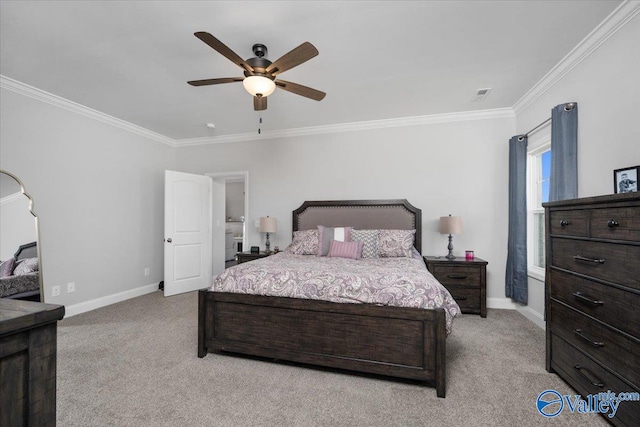 carpeted bedroom with ceiling fan and ornamental molding