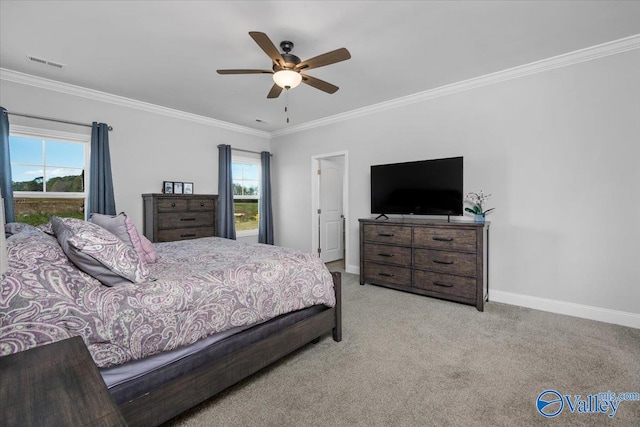 carpeted bedroom featuring ceiling fan, ornamental molding, and multiple windows