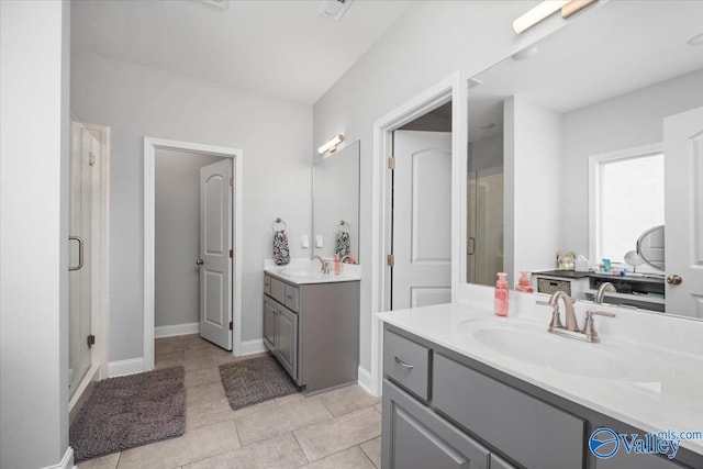 bathroom with vanity, tile patterned floors, and walk in shower