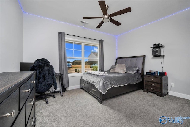 bedroom featuring ceiling fan and light colored carpet