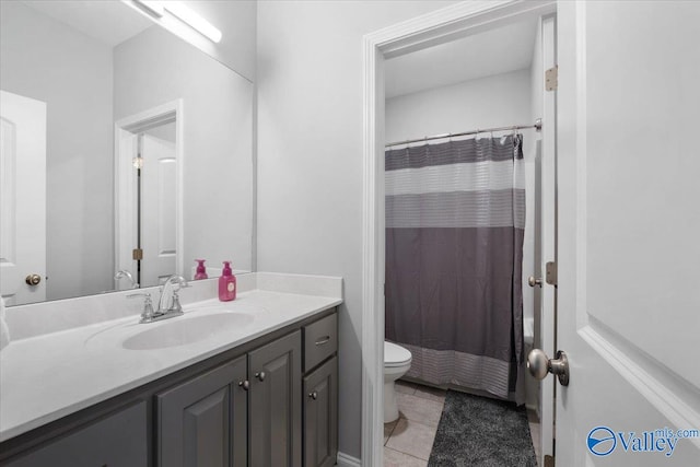 bathroom featuring tile patterned floors, vanity, toilet, and a shower with shower curtain