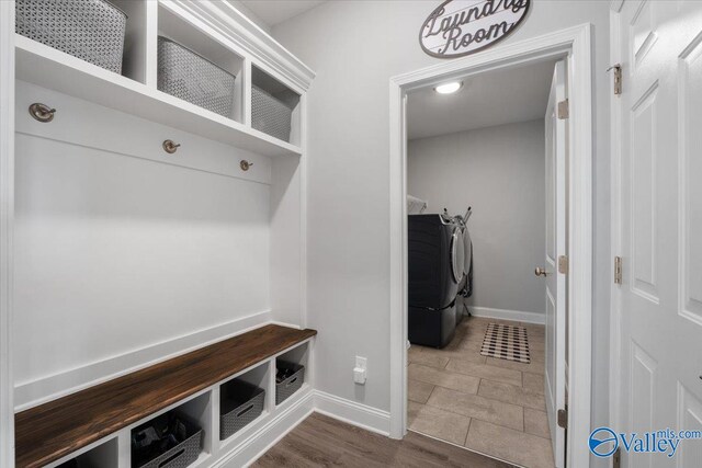 mudroom with dark hardwood / wood-style floors