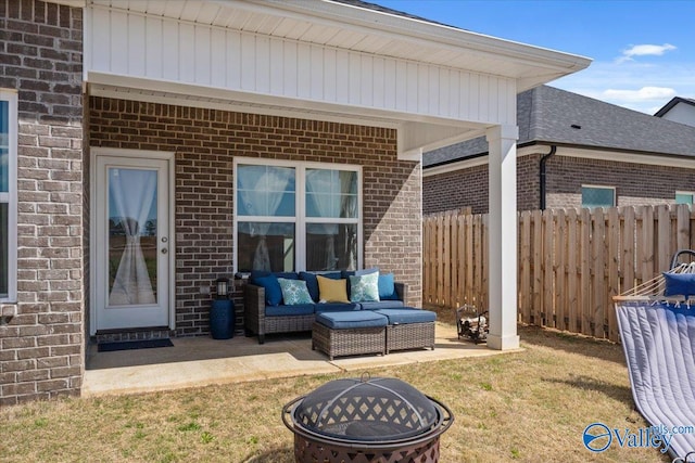 view of patio / terrace with an outdoor living space with a fire pit