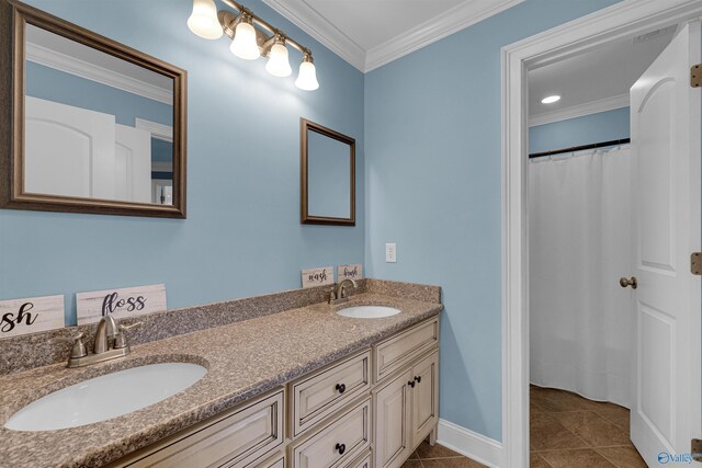 bathroom featuring double vanity, tile patterned floors, and crown molding