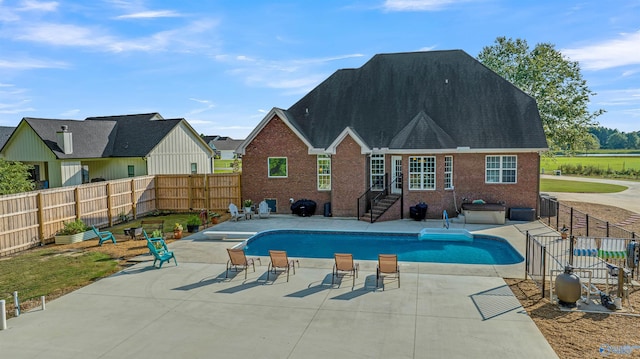 view of swimming pool featuring a patio