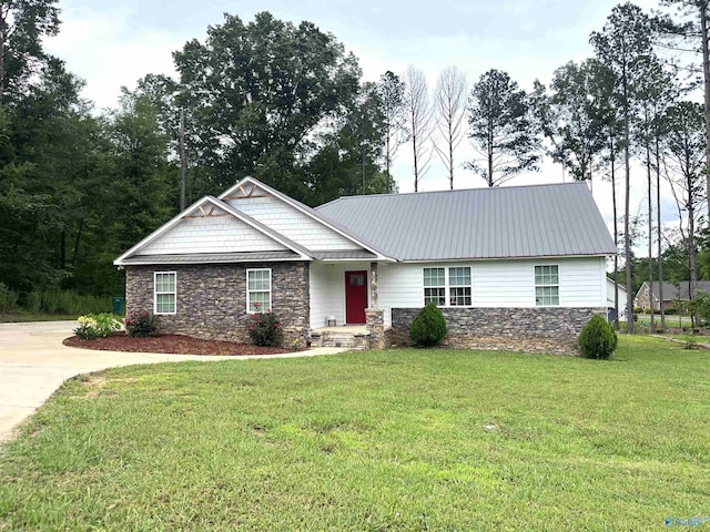 122 Taylor Ridge Rd, Leesburg, AL 35983 - view of front of house featuring stone siding, a front yard, driveway, and a metal roof