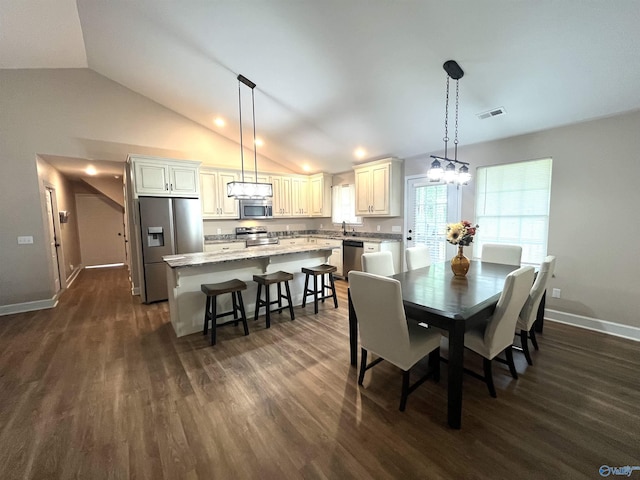122 Taylor Ridge Rd, Leesburg, AL 35983 - dining space with dark wood-style flooring, vaulted ceiling, and a chandelier