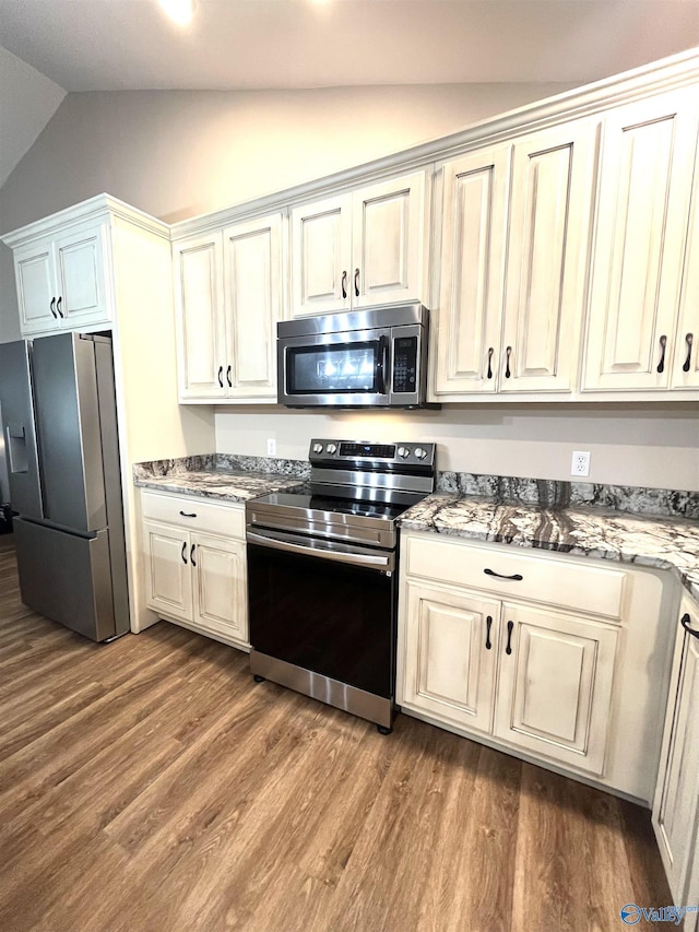 122 Taylor Ridge Rd, Leesburg, AL 35983 - kitchen featuring stainless steel appliances, lofted ceiling, dark wood finished floors, and stone countertops