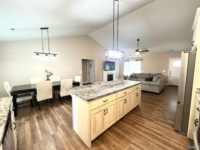 122 Taylor Ridge Rd, Leesburg, AL 35983 - kitchen featuring freestanding refrigerator, lofted ceiling, open floor plan, dark wood-type flooring, and a fireplace
