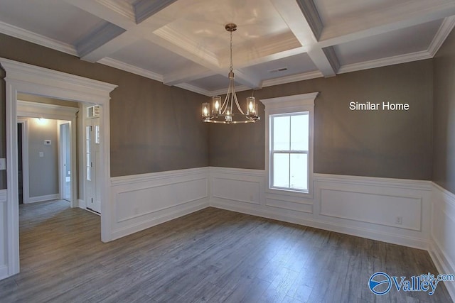 unfurnished dining area with a notable chandelier, beamed ceiling, coffered ceiling, and dark wood-style flooring