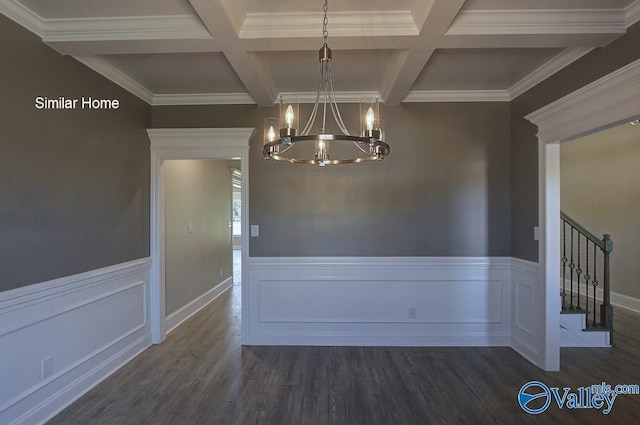 unfurnished dining area featuring stairway, beamed ceiling, wood finished floors, and a chandelier