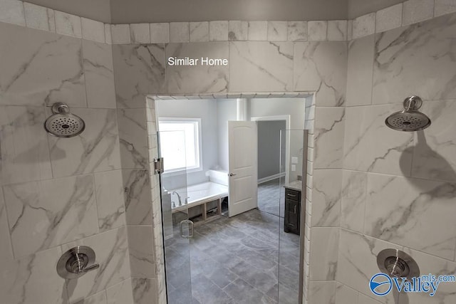 bathroom featuring a tile shower and a bath