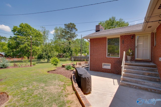 view of yard with a patio and fence