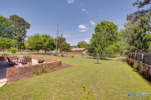 view of yard with a fenced backyard and a patio