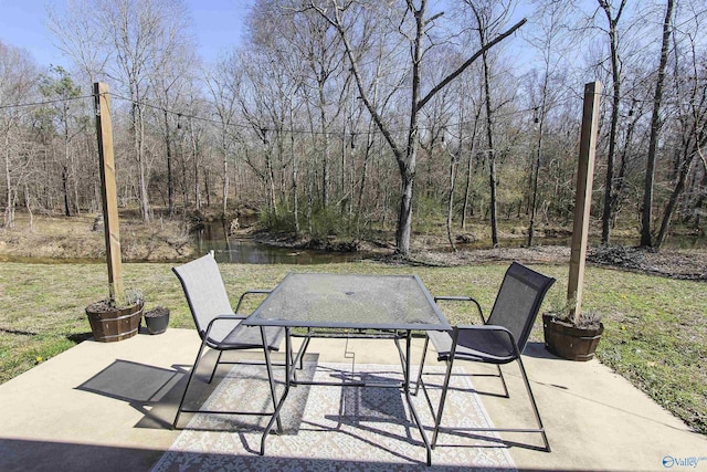 view of patio featuring a forest view