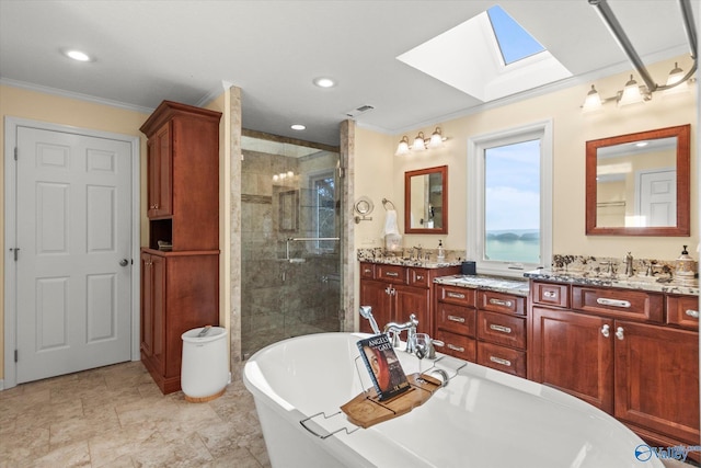 bathroom featuring independent shower and bath, a skylight, crown molding, and vanity