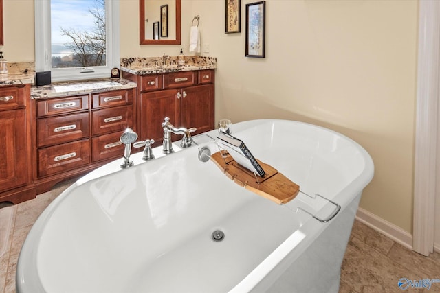 bathroom featuring a bathtub and vanity