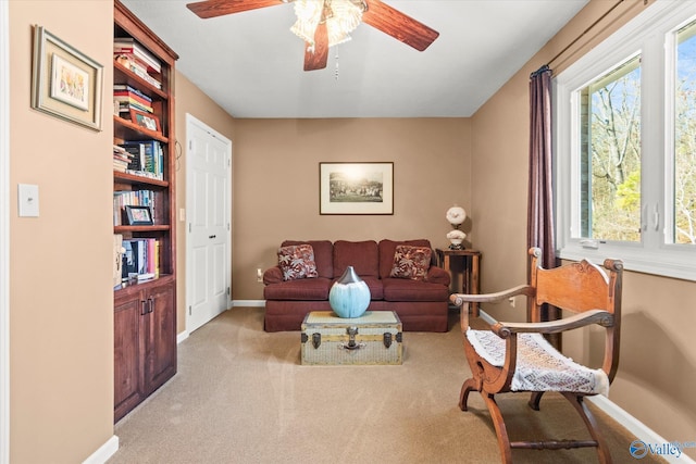 living room with ceiling fan and light carpet