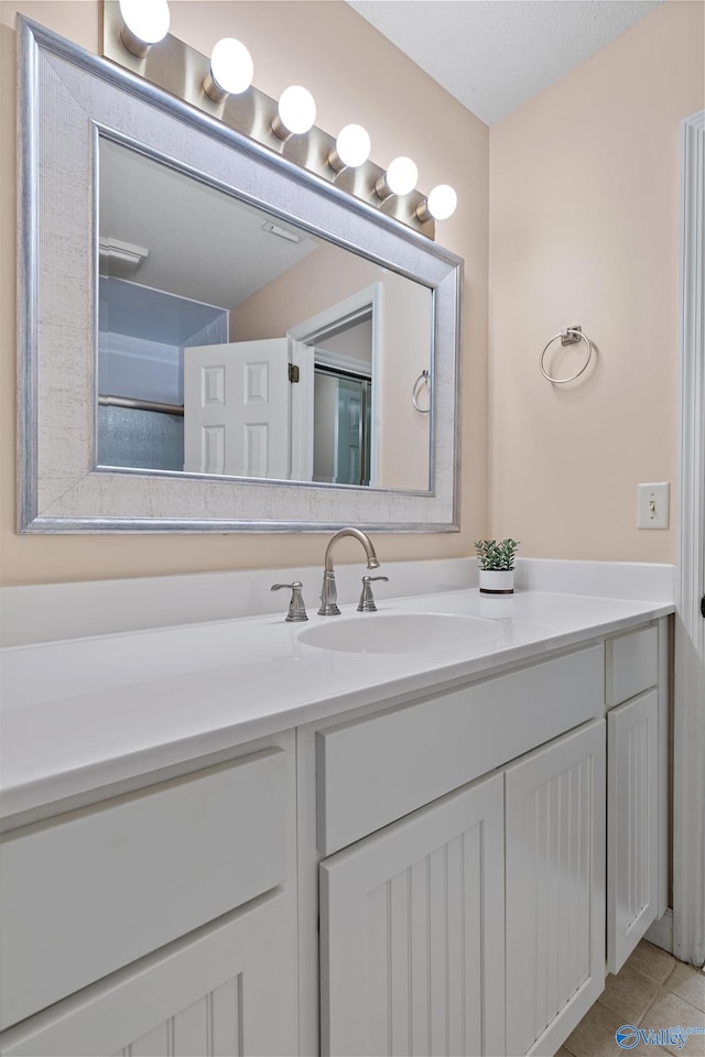 bathroom featuring tile patterned floors and vanity