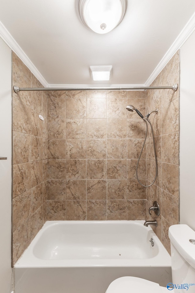 bathroom featuring tub / shower combination, toilet, and crown molding