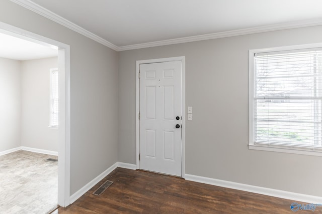 entryway featuring dark wood-style floors, baseboards, visible vents, and ornamental molding