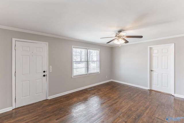 empty room featuring visible vents, baseboards, ceiling fan, ornamental molding, and dark wood-style floors